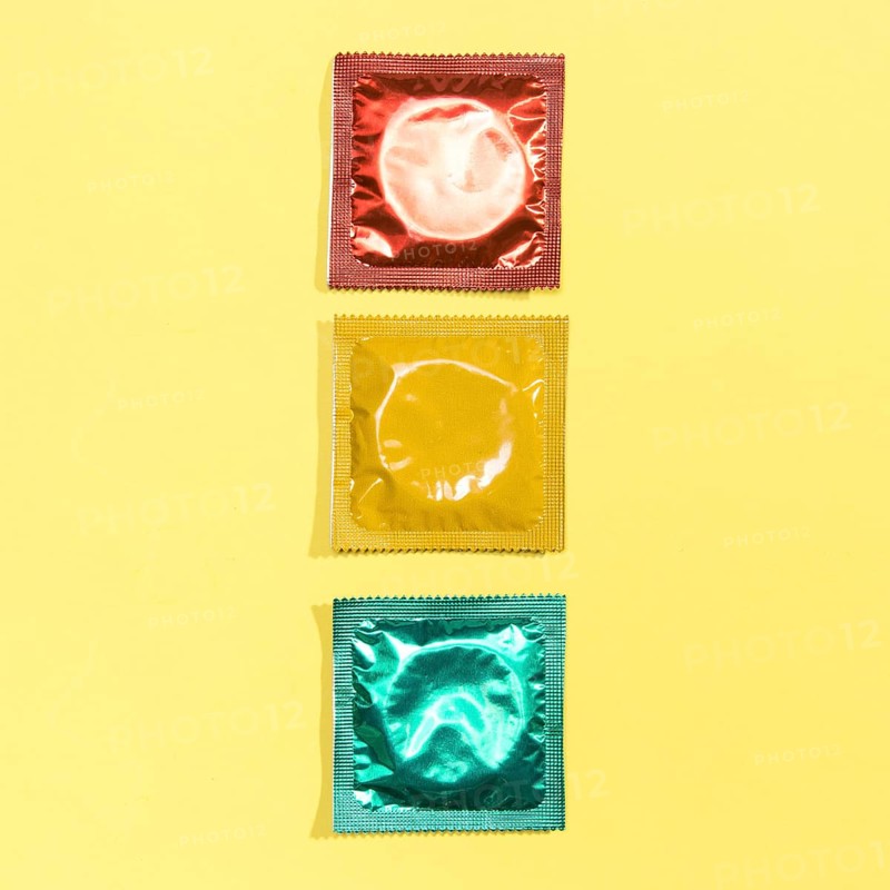 Top view red yellow green condoms