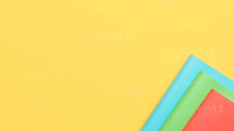 Yellow background with paper sheets corner