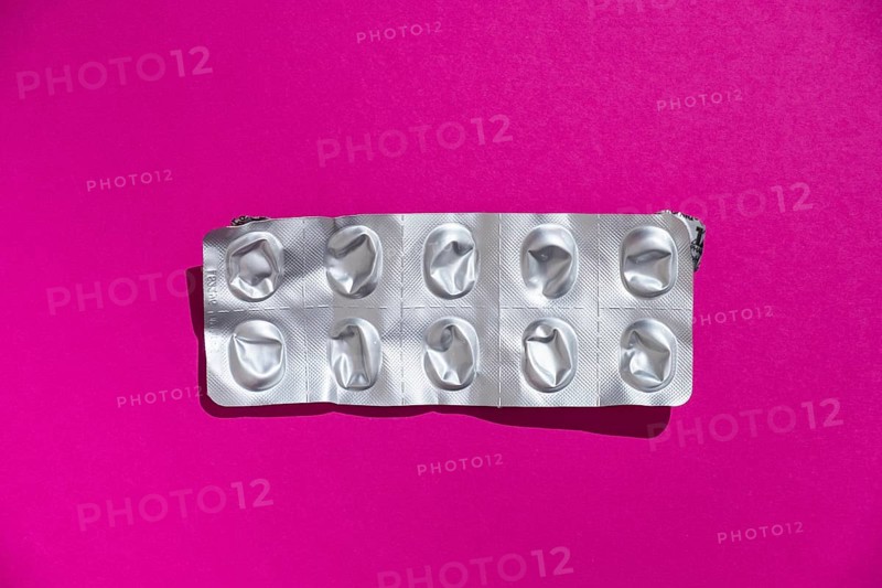 Empty tablet blister pack against a monochrome background
