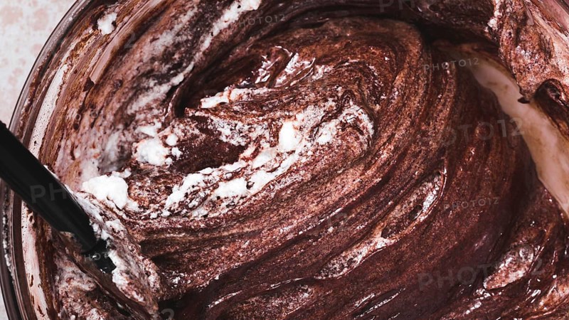Close up mixed chocolate cake dough bowl