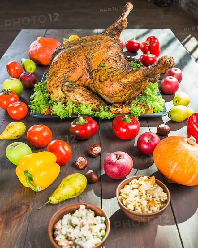 Roasted turkey with vegetables wooden table