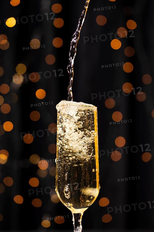 Front view pouring champagne glass