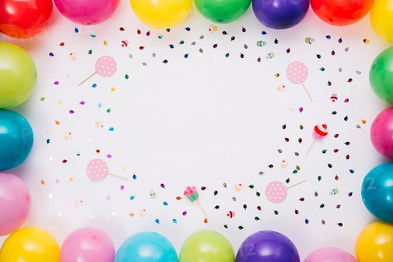 Colorful balloons border with confetti props white background