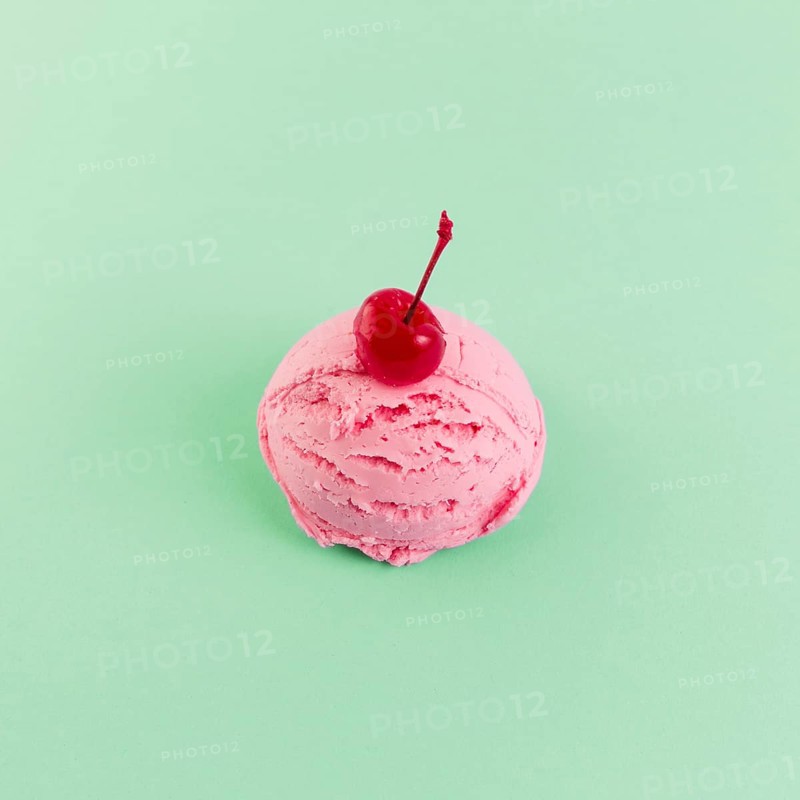 Pink ice cream ball with cherry