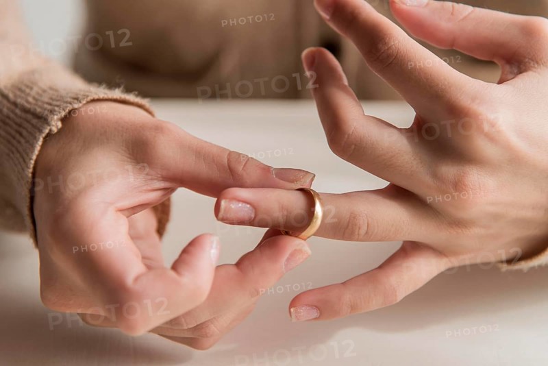 Close up hands with wedding ring