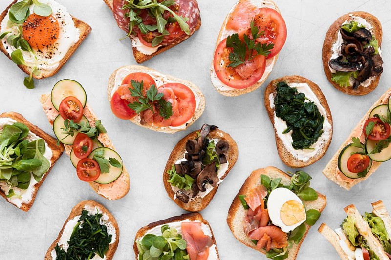 Top view fresh sandwiches arrangement white background