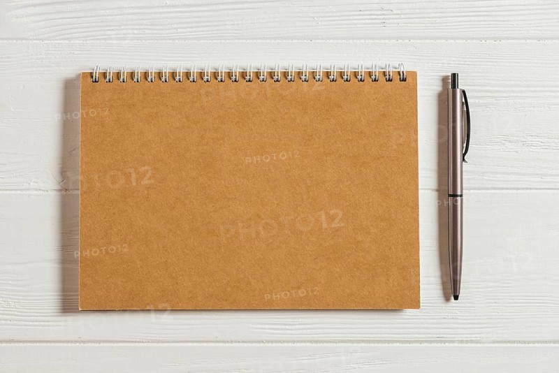 Notepad wooden table with pen