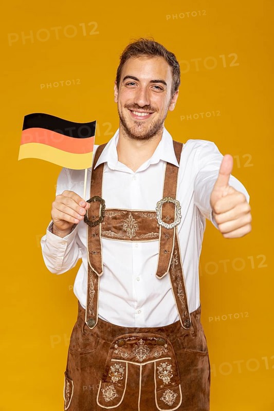 Front view man holding german flag
