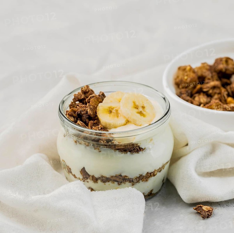 Close up delicious yogurt with granola banana