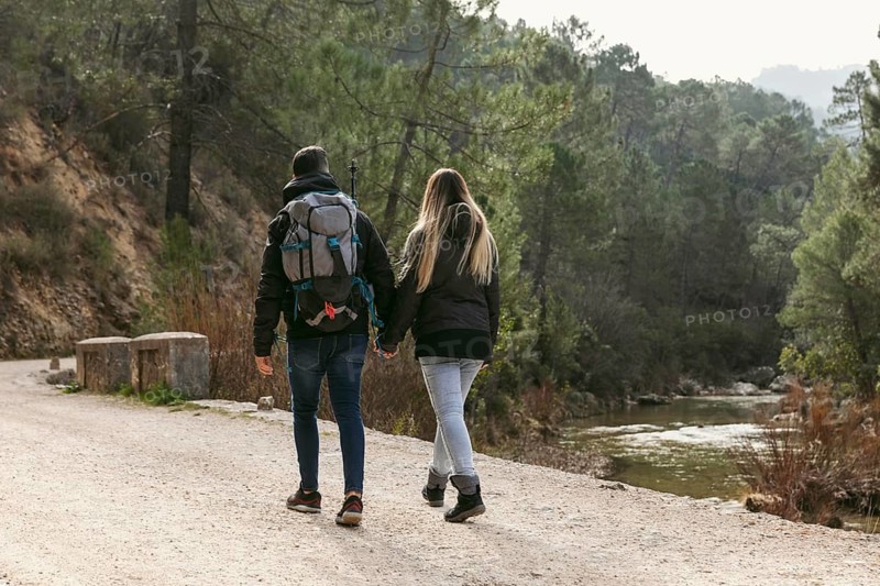 Couple with backpack exploring nature 6