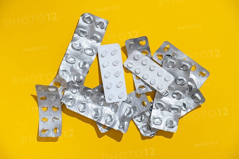 Empty tablet blister pack against a monochrome background