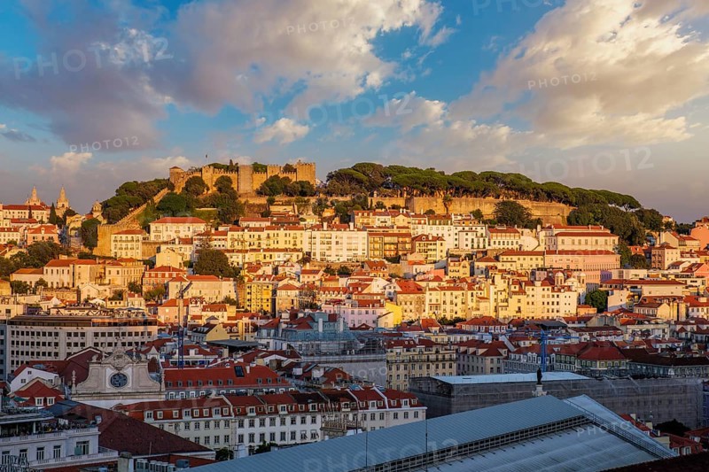 View of Lisbon city from Miradouro de Sao Pedro de Alcantara viewpoint on sunset. Lisbon