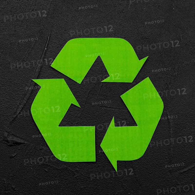 Recycle logo black plaster background