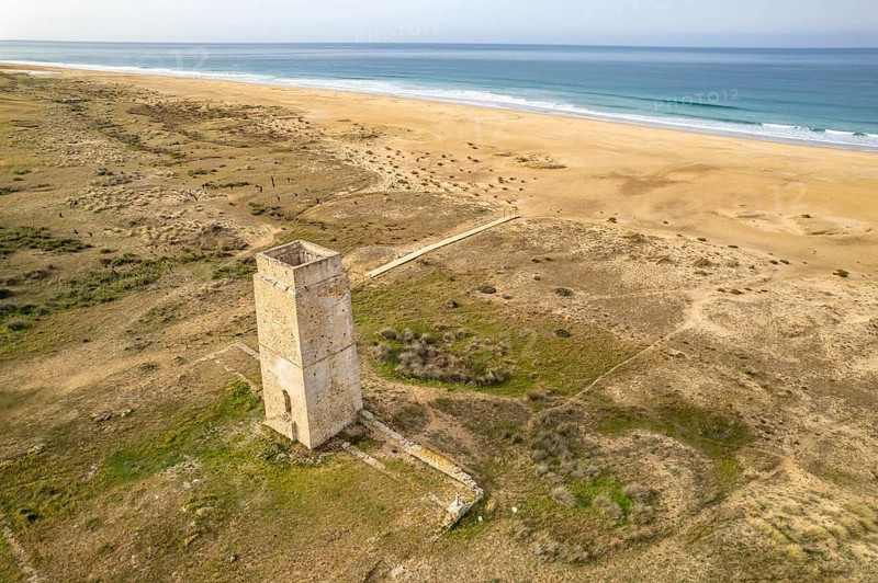 The Torre Vigia de Castilnovo tower at Playa de Castilobo beach