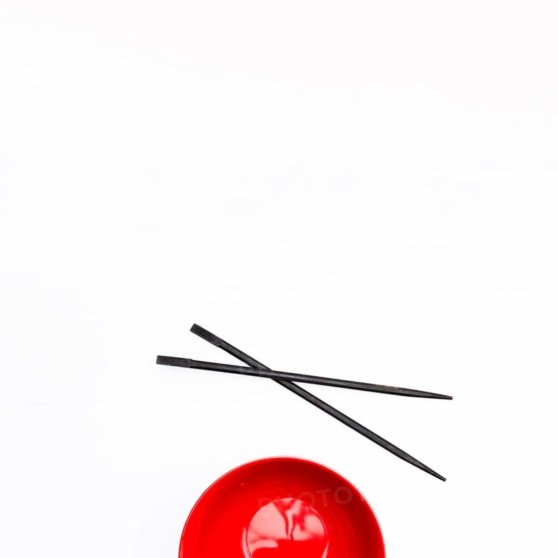 Empty red bowl chopstick isolated white background