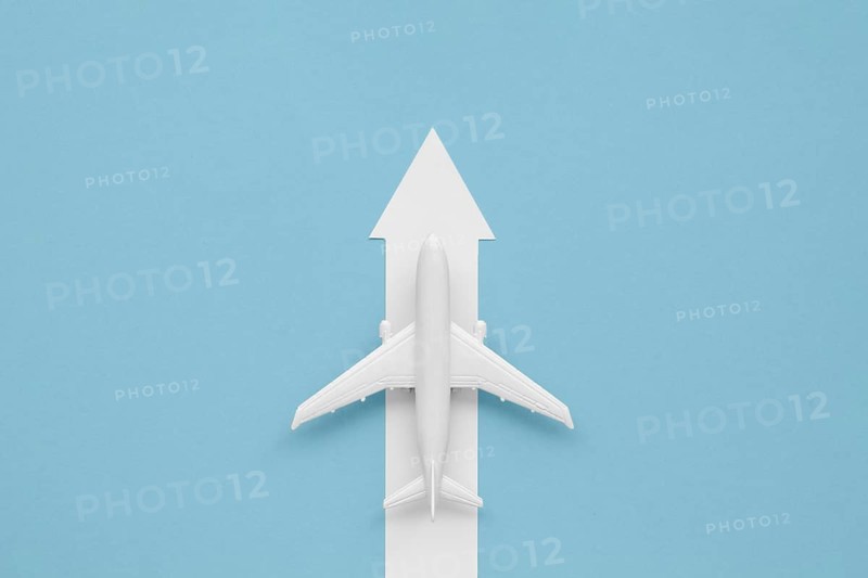 Flat lay arrow airplane direction