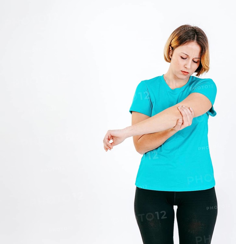 Pretty woman with hurting elbow
