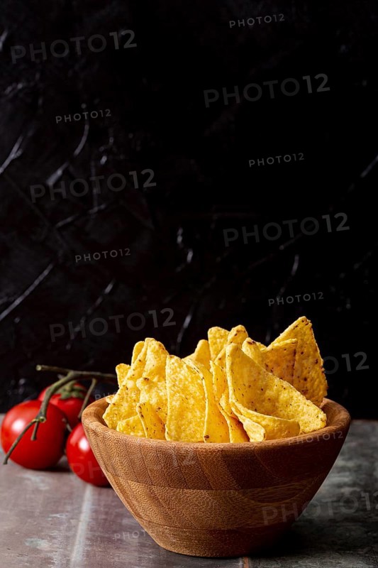 Tasty nachos wooden bowl tomatoes