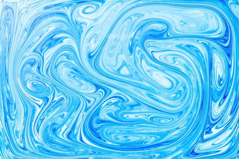 Style ebru painting with blue acrylic paint swirls