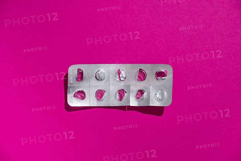 Empty tablet blister pack against a monochrome background
