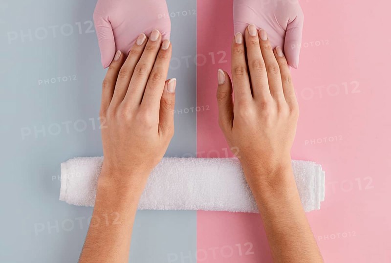 Manicurist holding hands