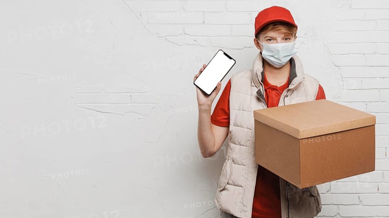 Medium shot guy holding box phone