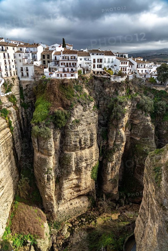 The white houses of the old town La Ciudad on a rocky plateau above the gorge Tajo de Ronda