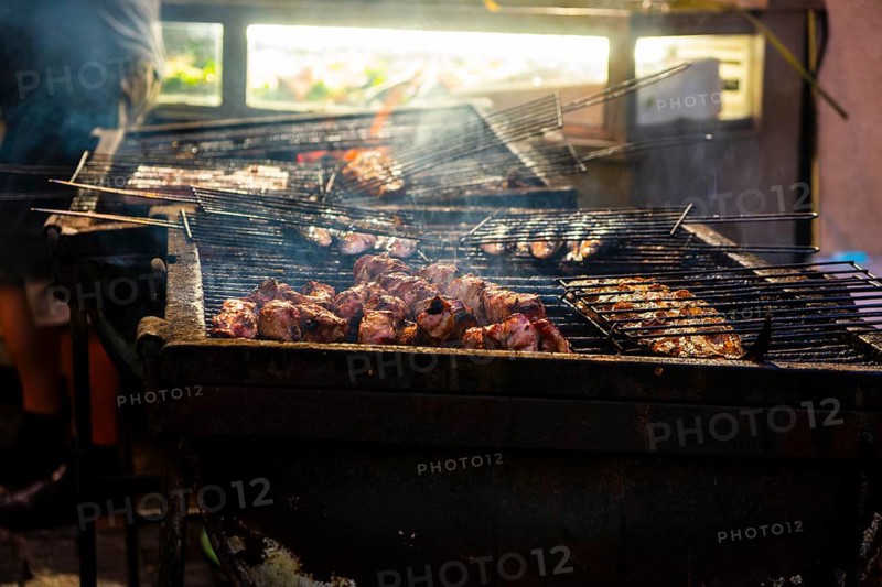 Fish and meat on a grill of a restaurant in the old town of Lisbon