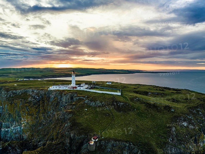 Sunset over Mull of Galloway Lighthouse from a drone