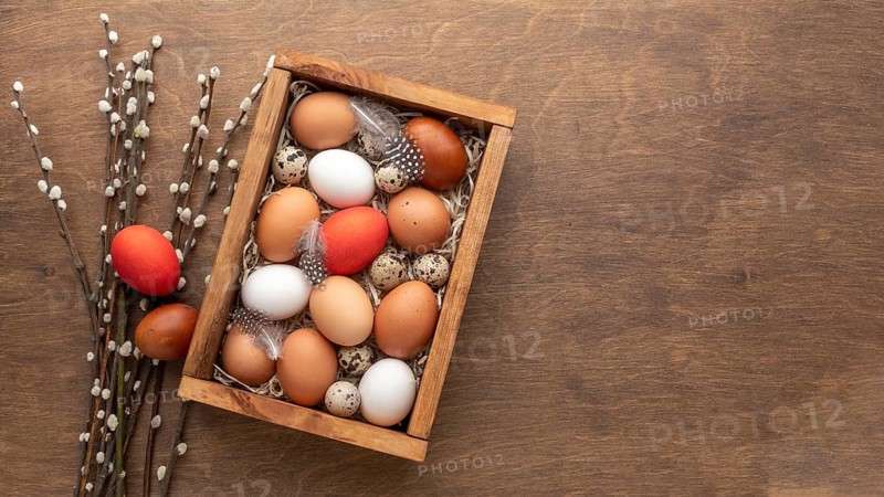 Flat lay box with eggs easter copy space