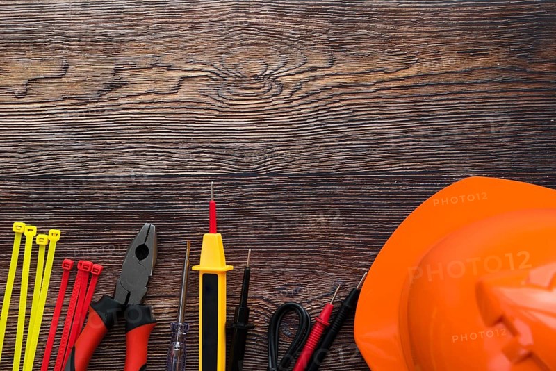 Top view electric equipment wooden background
