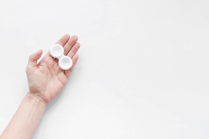 Container lenses hand white background