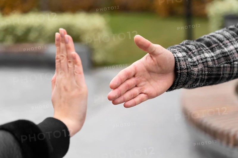 Person refusing shake hands protection
