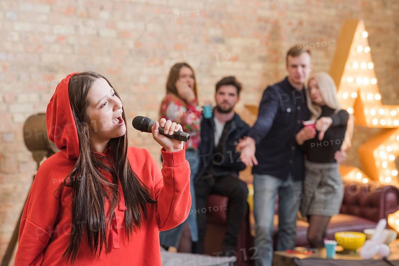 Friends singing karaoke party