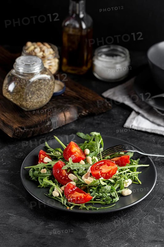 High view delicious salad dark plate
