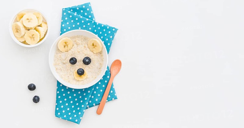 Top view milk oat flakes with fruits with copy space