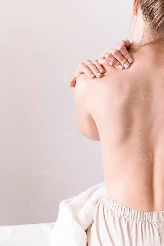 Woman experiencing shoulder pain