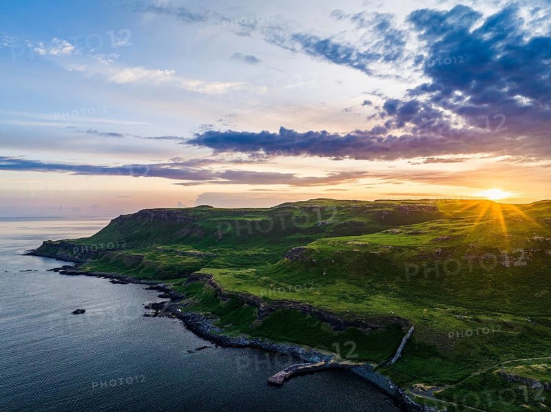 Sunset over Calgary Beach and Bay from a drone