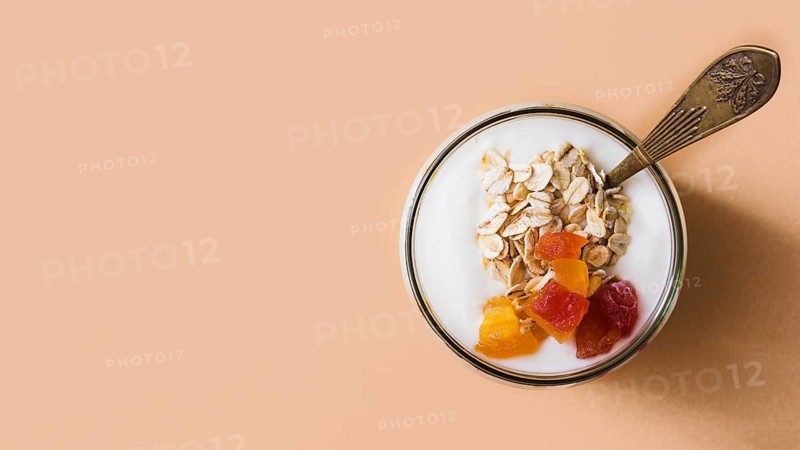 Panoramic view sour cream yogurt oats fruits topping jar