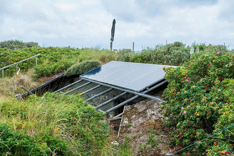 Solar panel above a former bunker of the German Wehrmacht on the North Sea island of Terschelling