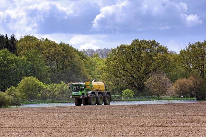 Farmer spraying pesticides