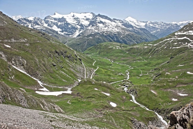 Photo with reduced dynamic saturation HDR of mountain pass alpine mountain road alpine road pass road pass Col de l'Iseran