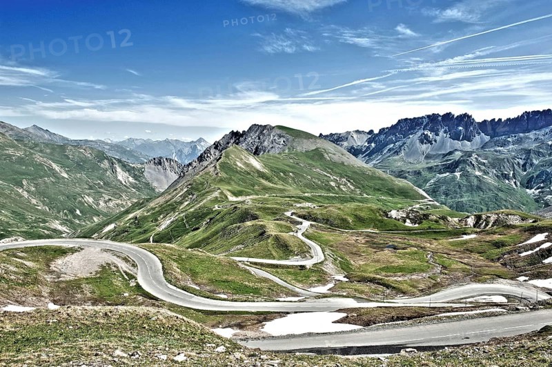 Photo with reduced dynamic saturation HDR of mountain pass alpine mountain road alpine road pass road pass in French Alps