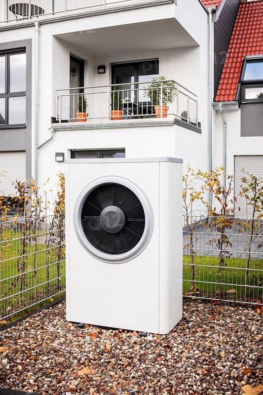 Air source heat pump in front of an apartment building in Hilden