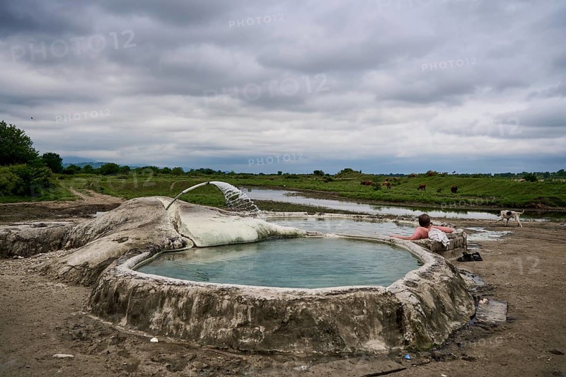 Tourist bathing in springs of Amaghleba