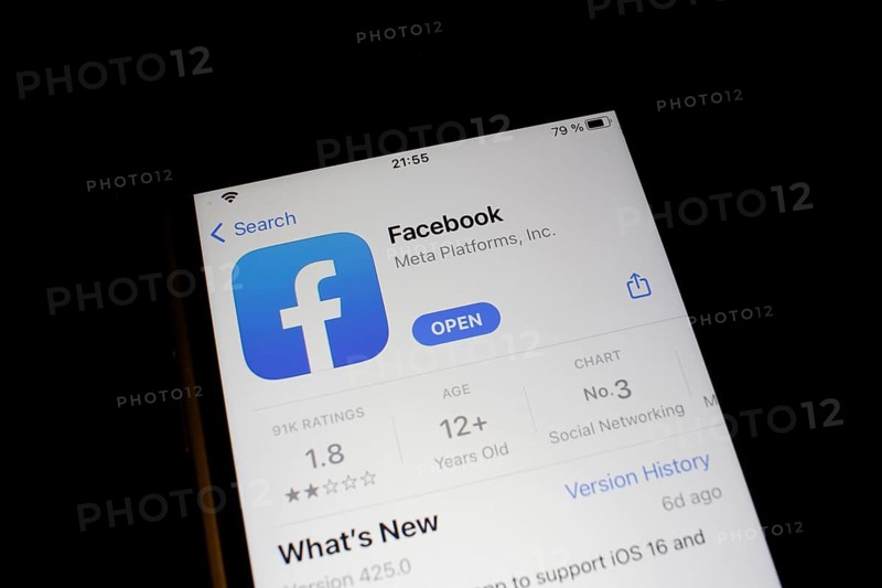 Detailed view of a smartphone with Facebook app in the iPhone App Store