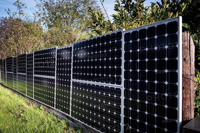 Solar panels as a garden fence and privacy screen of a house on a street in Langenfeld