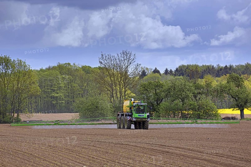 Farmer spraying pesticides