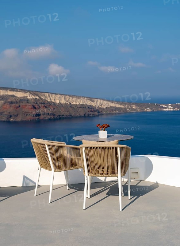Sea view from terrace with chairs and table