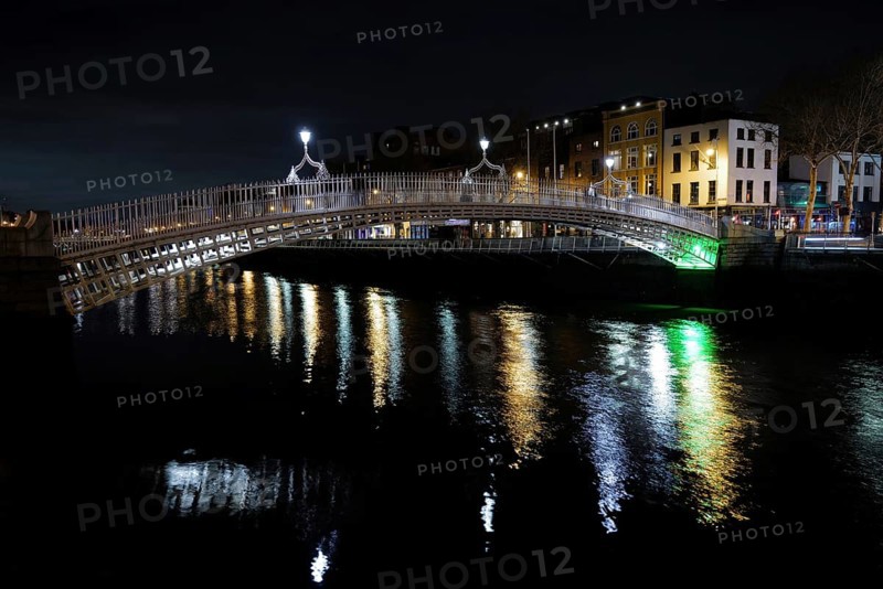 A view of the Ha'penny Bridge in Dublin at night. Dublin